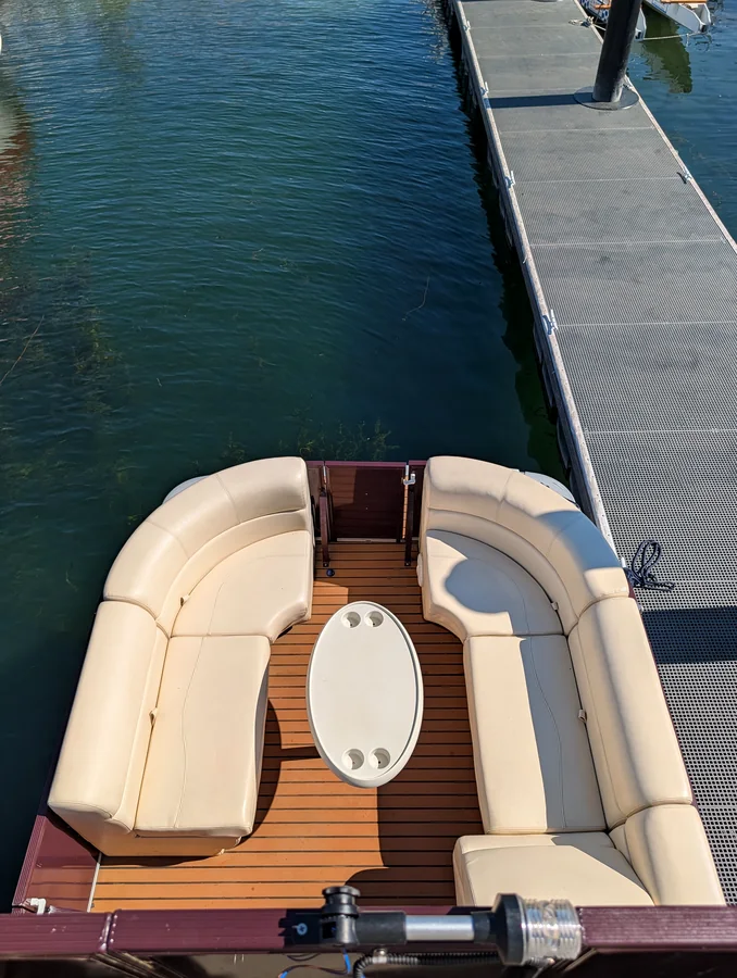 Bow seating area with table on the double decker pontoon